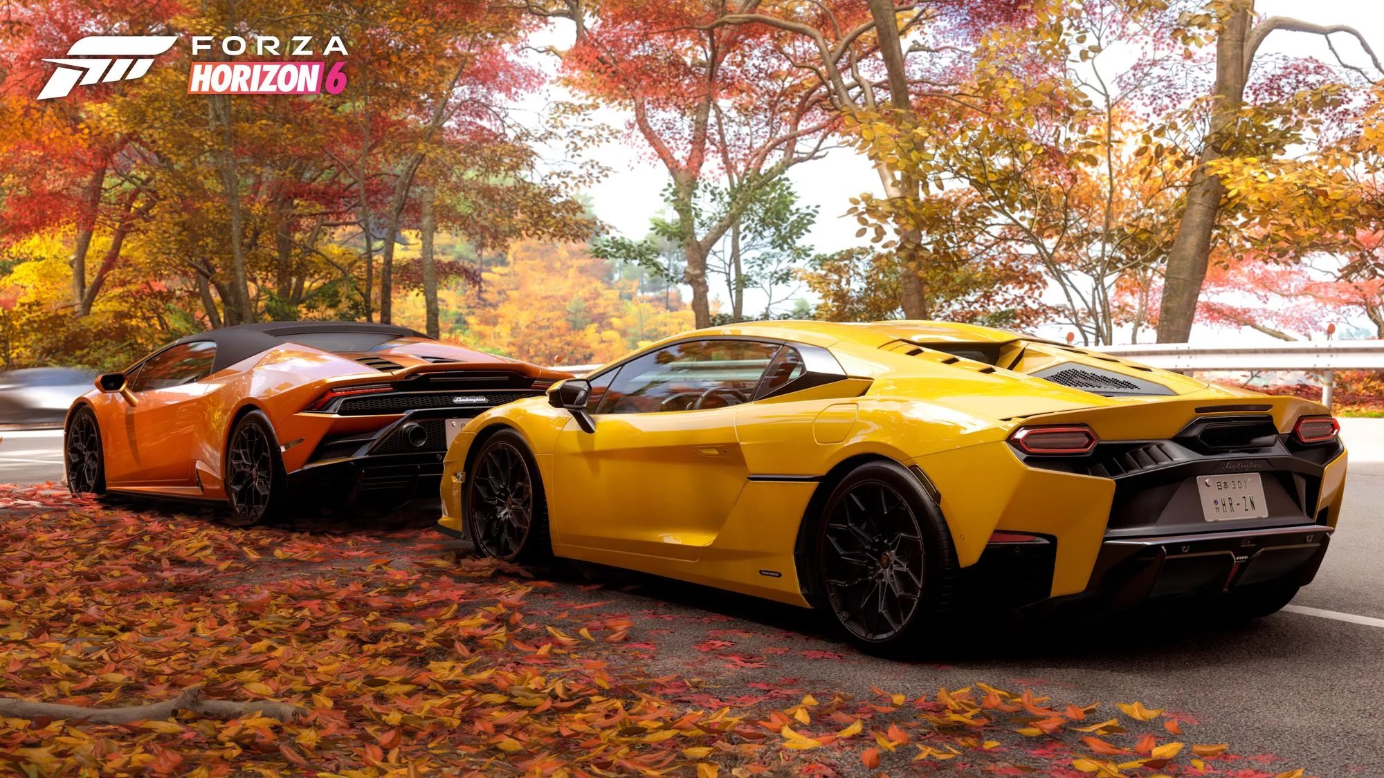 報酬車のランボルギーニ2台が紅葉の中に並ぶ
